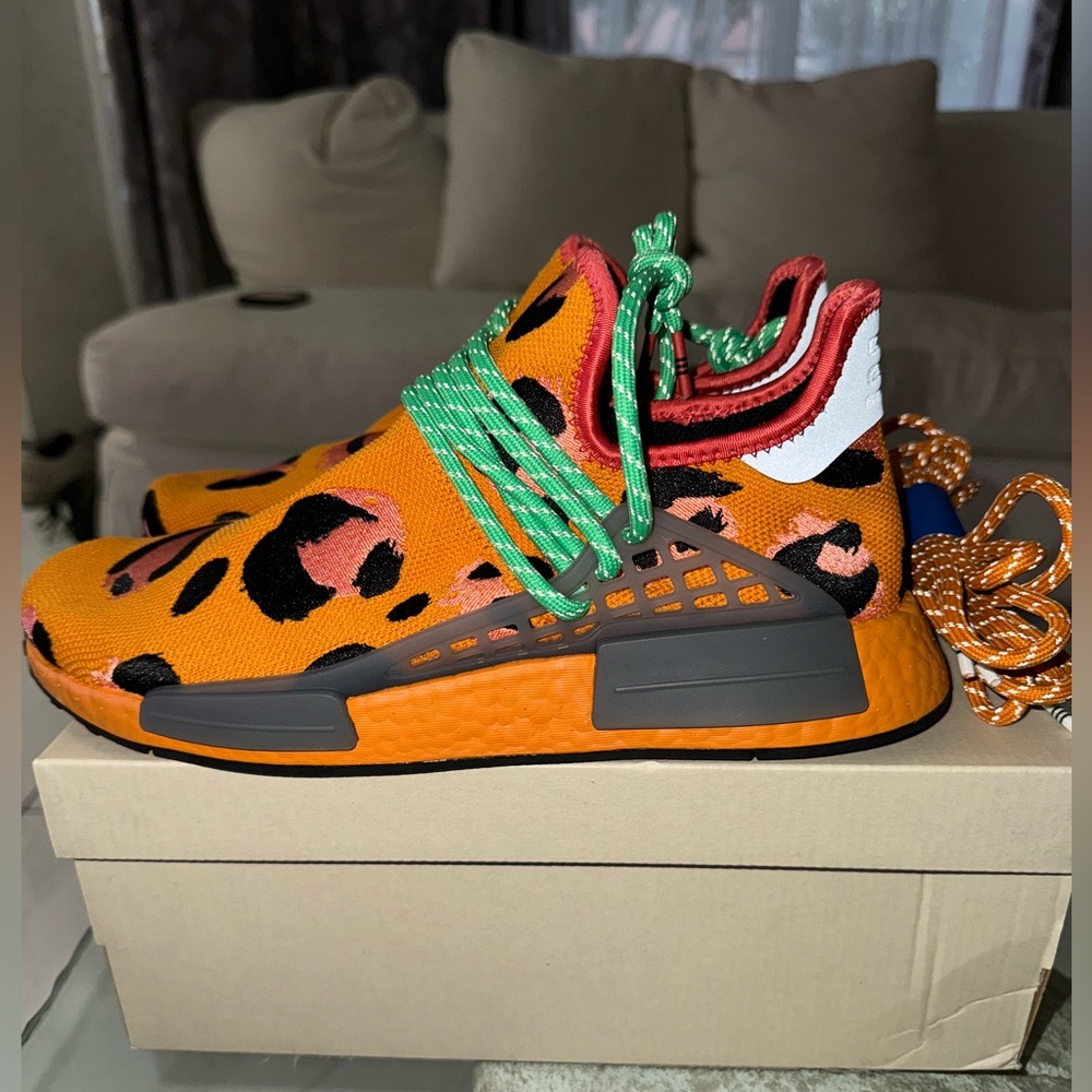 Pharell williams animal print shoe. Hu nmd. 8.5 in men’s and 10.5 in woman’s